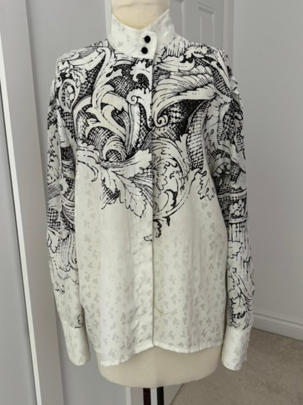 Louis Feraud blouse with distinct black baroque print against white background